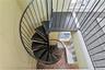 Spiral staircase in the mudroom up to the office/gym