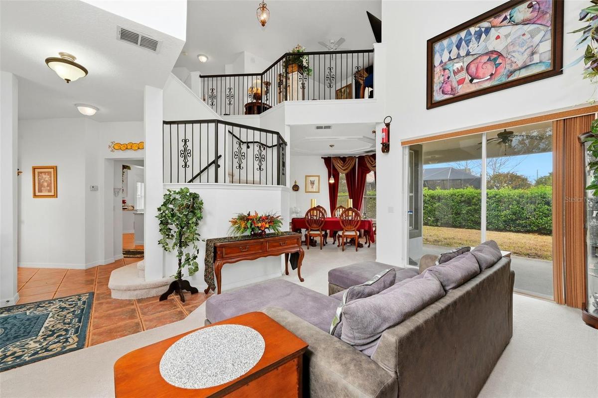 Formal living room, dining room in back with entrance to butlers pantry