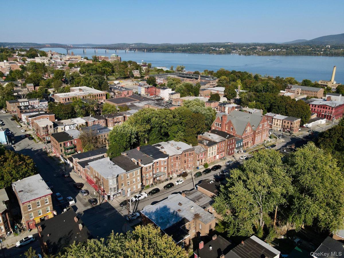 View of property location featuring a nearby body of water and a notable bridge