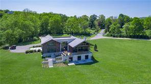 Just 90 minutes from NYC and minutes to both Kent and Sherman Connecticut this completely custom built stone and timber Contemporary home offers modern country living on one of the ...