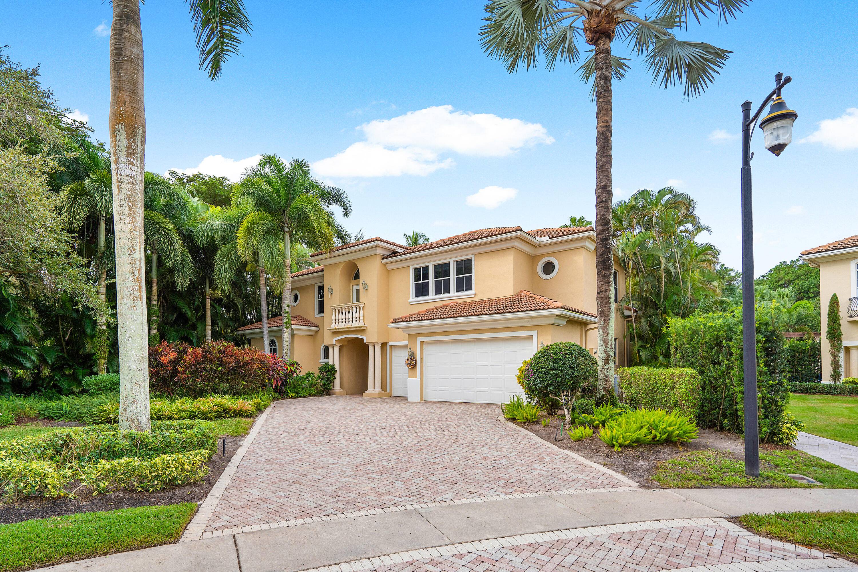 Beautiful two story courtyard home located in a cul de sac on an oversized lot in Mizner Country Club.