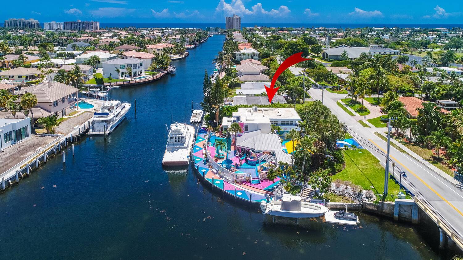 Vibrant happy ambiance on 197' of gorgeous waterfront on the South Grand Canal in sought after Lighthouse Point.
