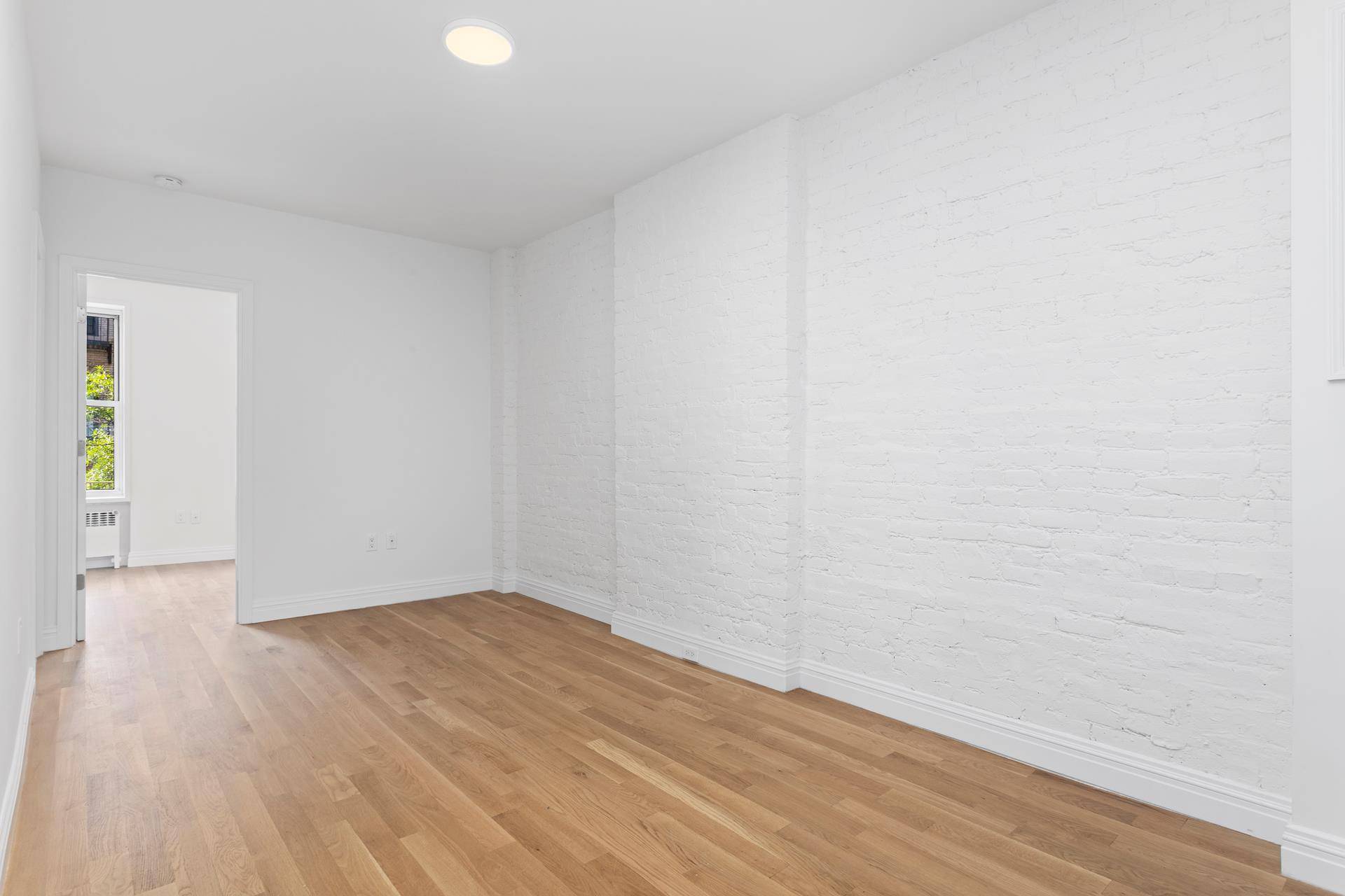Move right into this newly renovated Two Bedroom, two bath apartment with its sun flooded south facing windows, hardwood oak floors and white stained exposed brick !