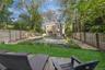 Fenced backyard with a patio area and a pool