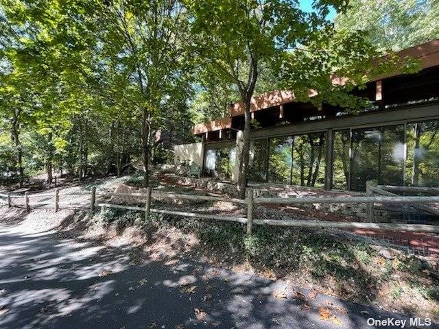Unique Earth Property built Into a sloping private wooded 1 2 acre Lot.