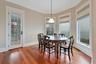 Dining area featuring hardwood / wood-style floors and ornamental molding
