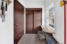 Hall featuring tile patterned flooring