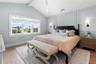 Guest Suite II Bedroom with King Bed and vaulted beam ceiling