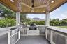 XL BIG GREEN EGG, PROPANE GRILL & PROPANE HIBACHI GRILL ALL BUILT IN TO THIS GORGEOUS SUMMER KITCHEN. CONCRETE WORK DONE BY THIEL STUDIOS