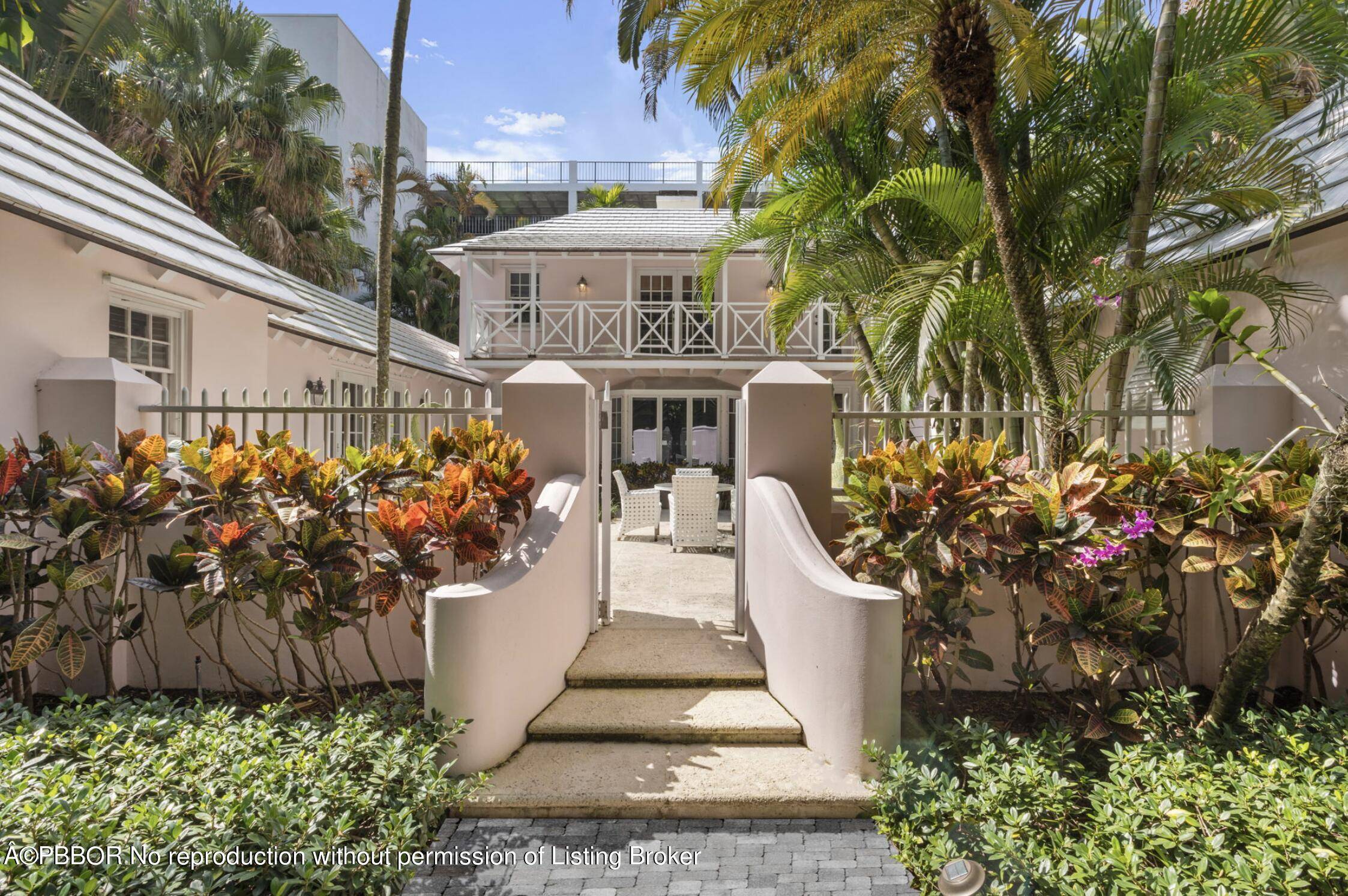 Situated in the center of Palm Beach Island only steps from the beach and a few blocks from Worth Avenue, this landmarked two story Bermuda home designed by Belford Shoumate ...