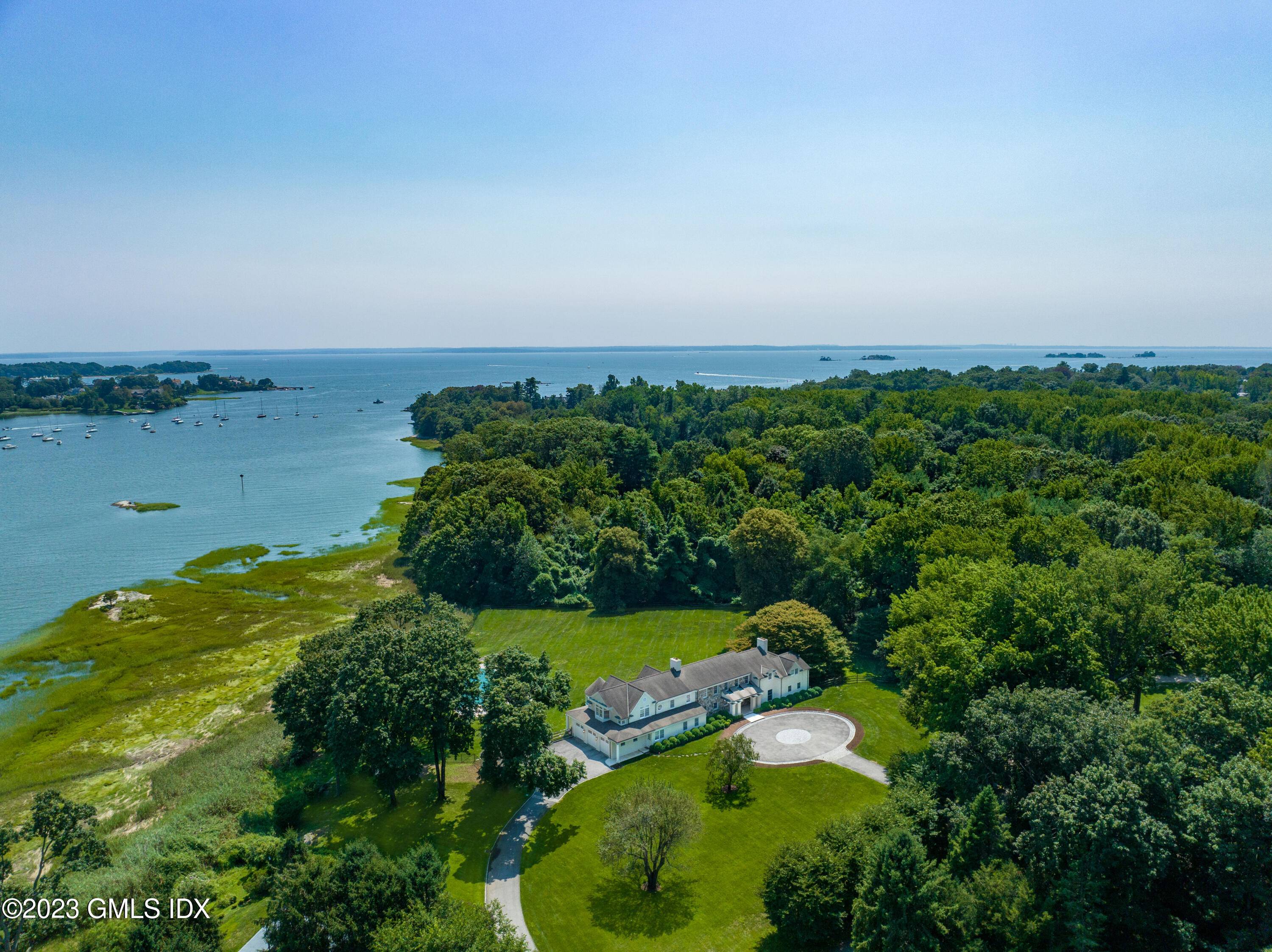This truly magnificent 10 acre waterfront compound on Long Island Sound has a remarkably private setting with 440' of direct water frontage.