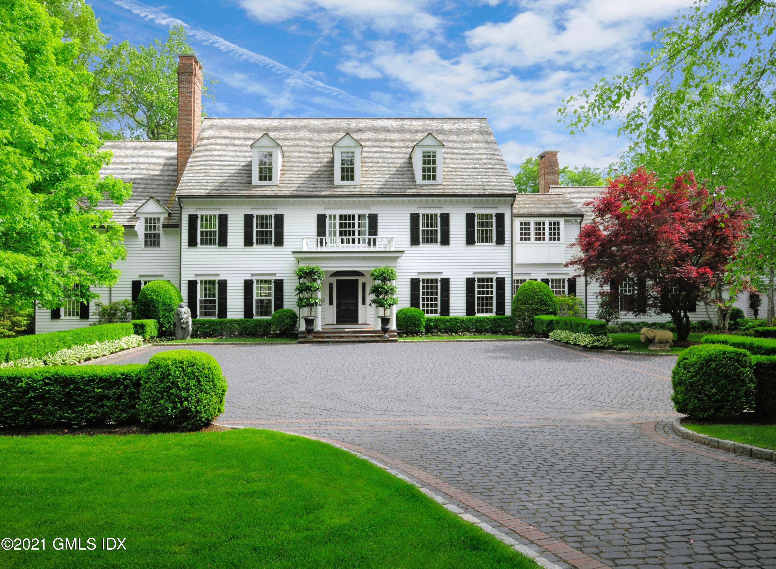 Set among the most notable estates in Greenwich, this Conyers Farm classic pairs a timeless colonial design with 16 private acres.