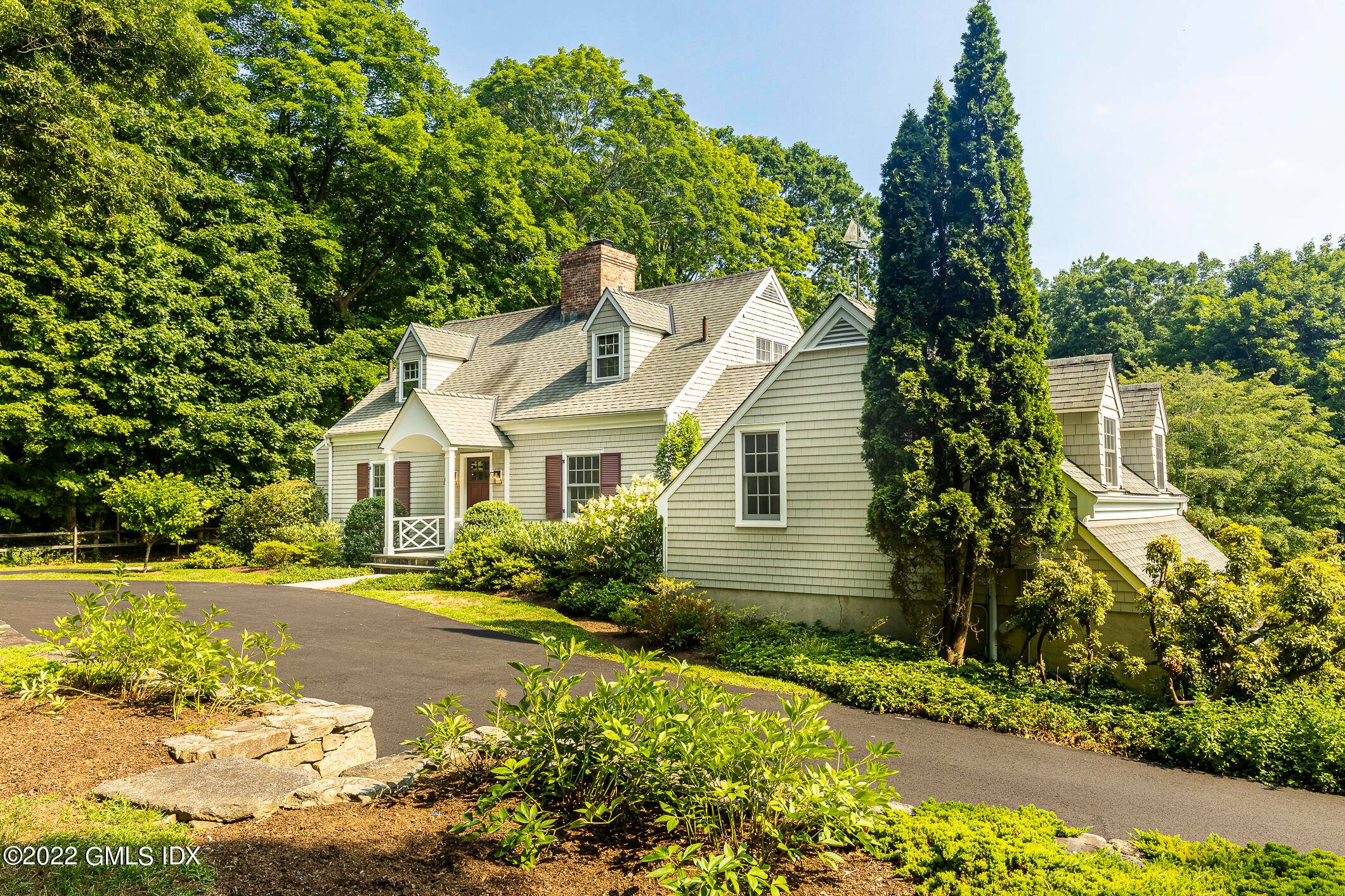 In a delightful residential neighborhood of Central Greenwich, this expanded cape cod house has been lovely cared for and updated.