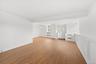 Grand open, bright and spacious living room with new luxury vinyl flooring and freshly painted.