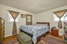Bedroom with dark wood finished floors