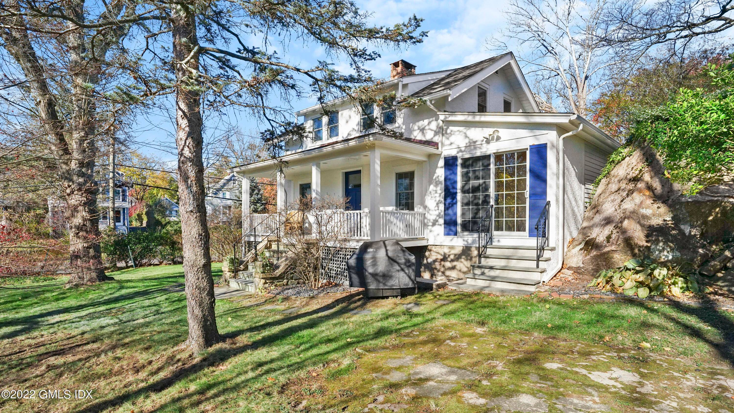Charming cottage with an inviting front porch in the heart of Cos Cob.