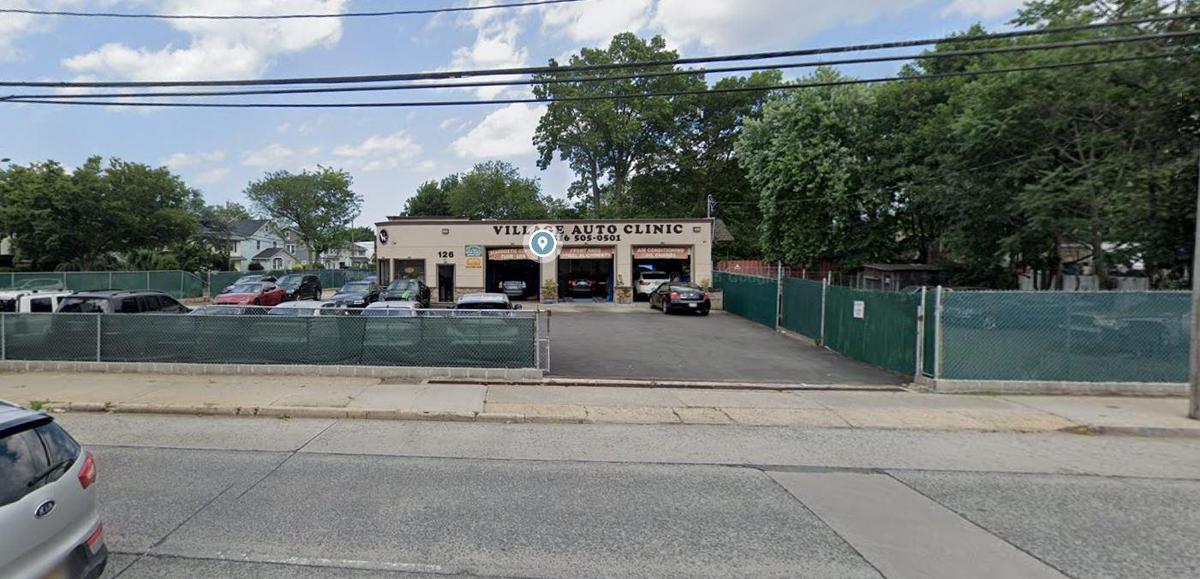 View of commercial location featuring uncovered parking