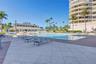 Grand Bay Swimming Pool Area and Barbecue. New Patio Furniture, Lounge Chairs, Sofa's, Umbrellas and Barbecue Area