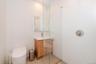 Bathroom featuring vanity and an enclosed shower