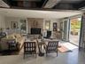 Living area featuring a fireplace and concrete floors
