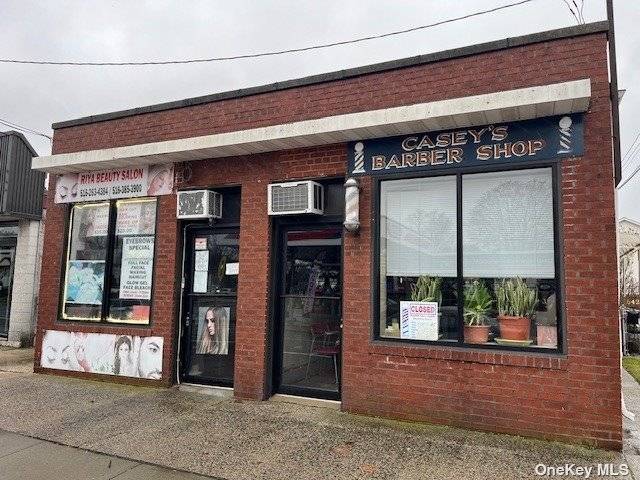 This commercial zoned stand alone building has two storefronts and a mixed used unit as well as a 1 car garage and a 3 car driveway.
