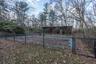 View of yard featuring a gate and an outbuilding