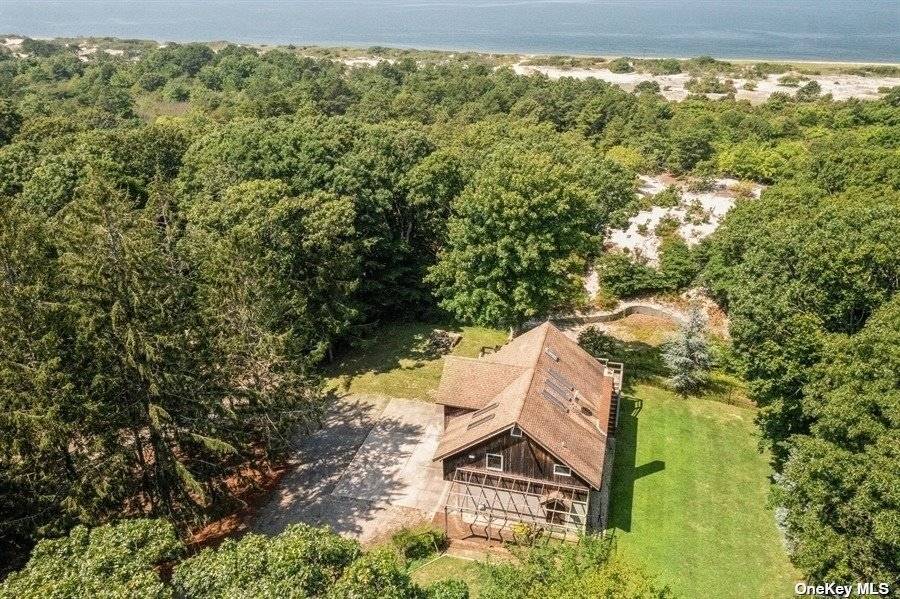 Spectacular Waterfront Oasis Located In Peconic Dunes.