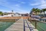 View from the end of the dock looking north towards the rear of the home (homes on either side are fully remediated).