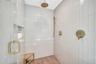 Full bathroom featuring a tile shower