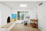 Living area featuring a skylight and light wood finished floors