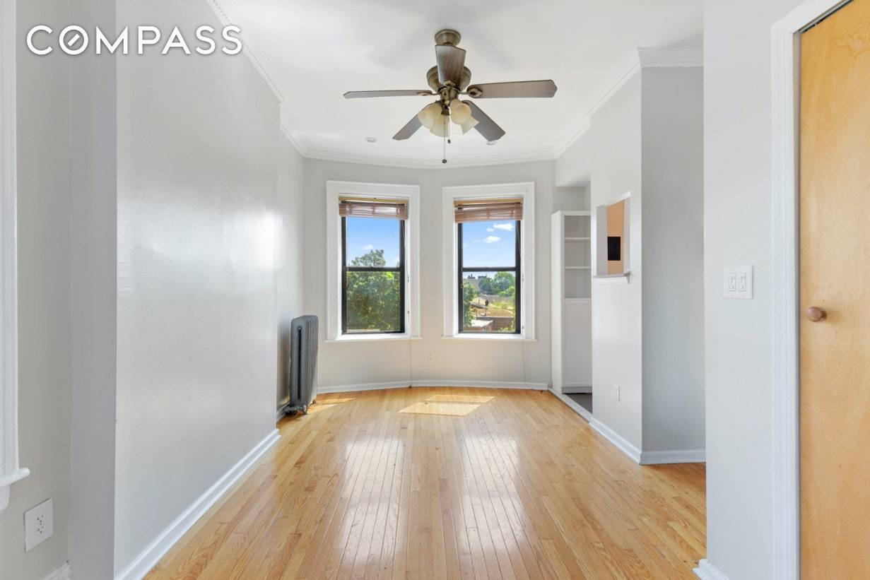 Welcome Home to your top floor, corner oasis in the rear of this intimate co op building.