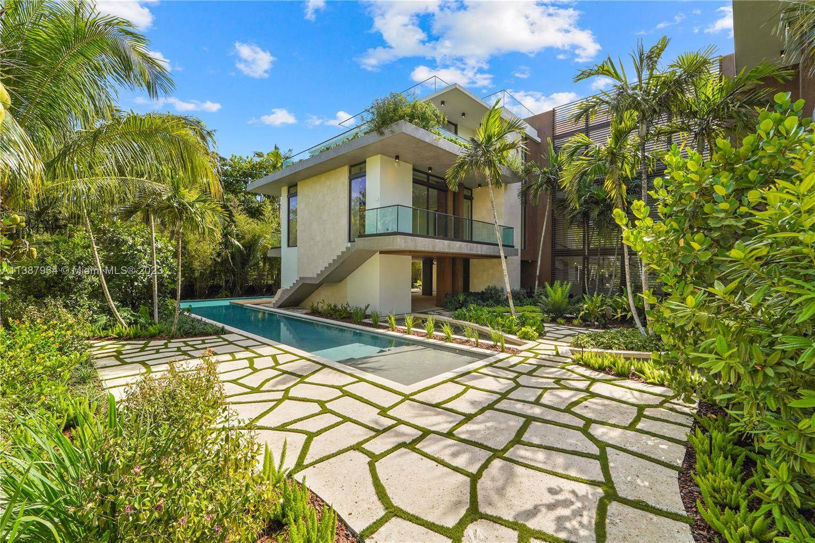 Just Completed Tropical Modern Oasis with 20, 000 total sf of seamless indoor outdoor living that highlights the best of South Florida lifestyle.