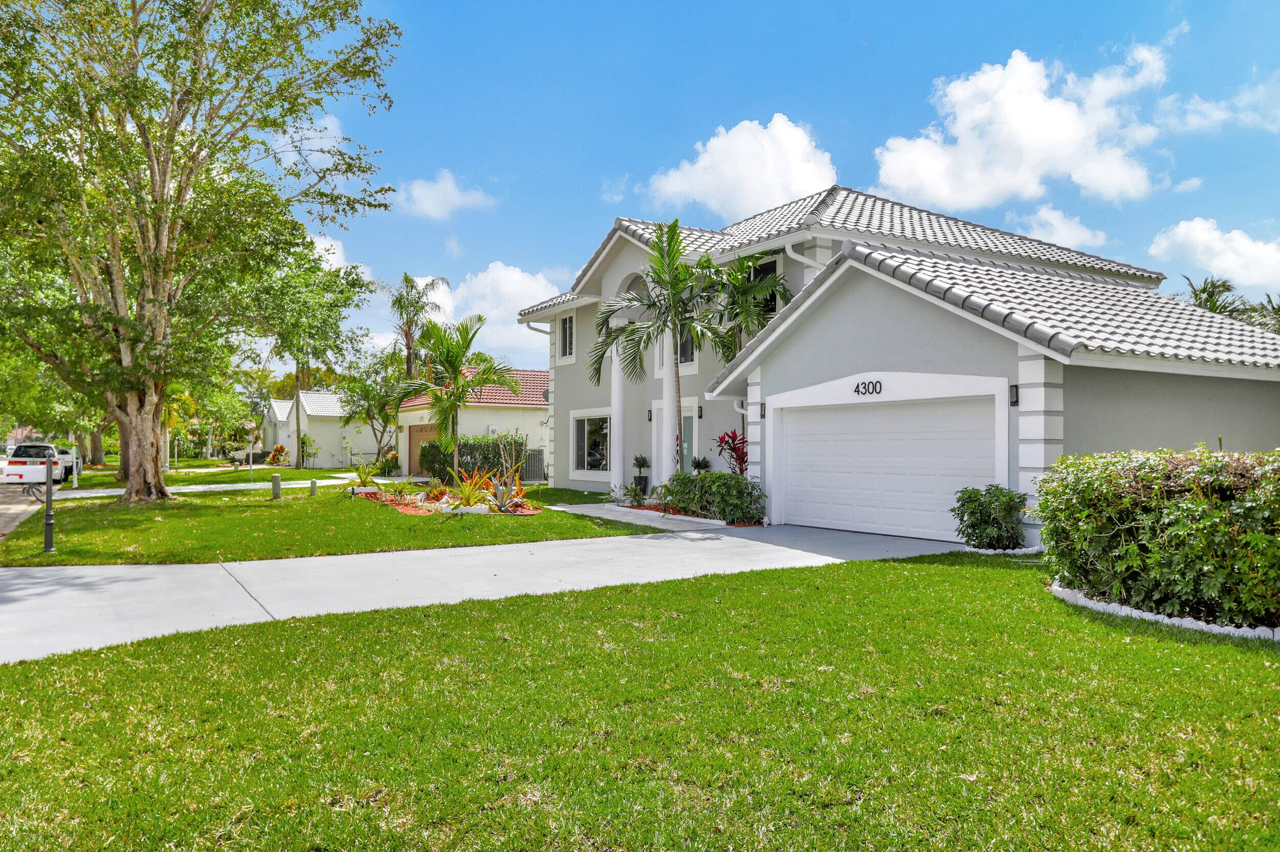 This stunning 4BR, 2 1 2 Bath home is on an oversized corner lot, and features a brand new tile roof, all new impact storm protection windows, exterior doors, and ...