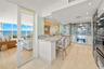 2 way mirror in the living room allows the views to carry through to the kitchen