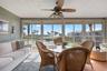Wake up to beautiful water views, palm trees, and peaceful sunrises from this bright coastal condo.
