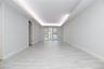 Unfurnished room with a tray ceiling and baseboards
