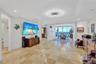 Sliding glass panels, separate living room from TV/den area With modern lighting and Dimable spot lights