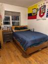 Bedroom with wood-type flooring