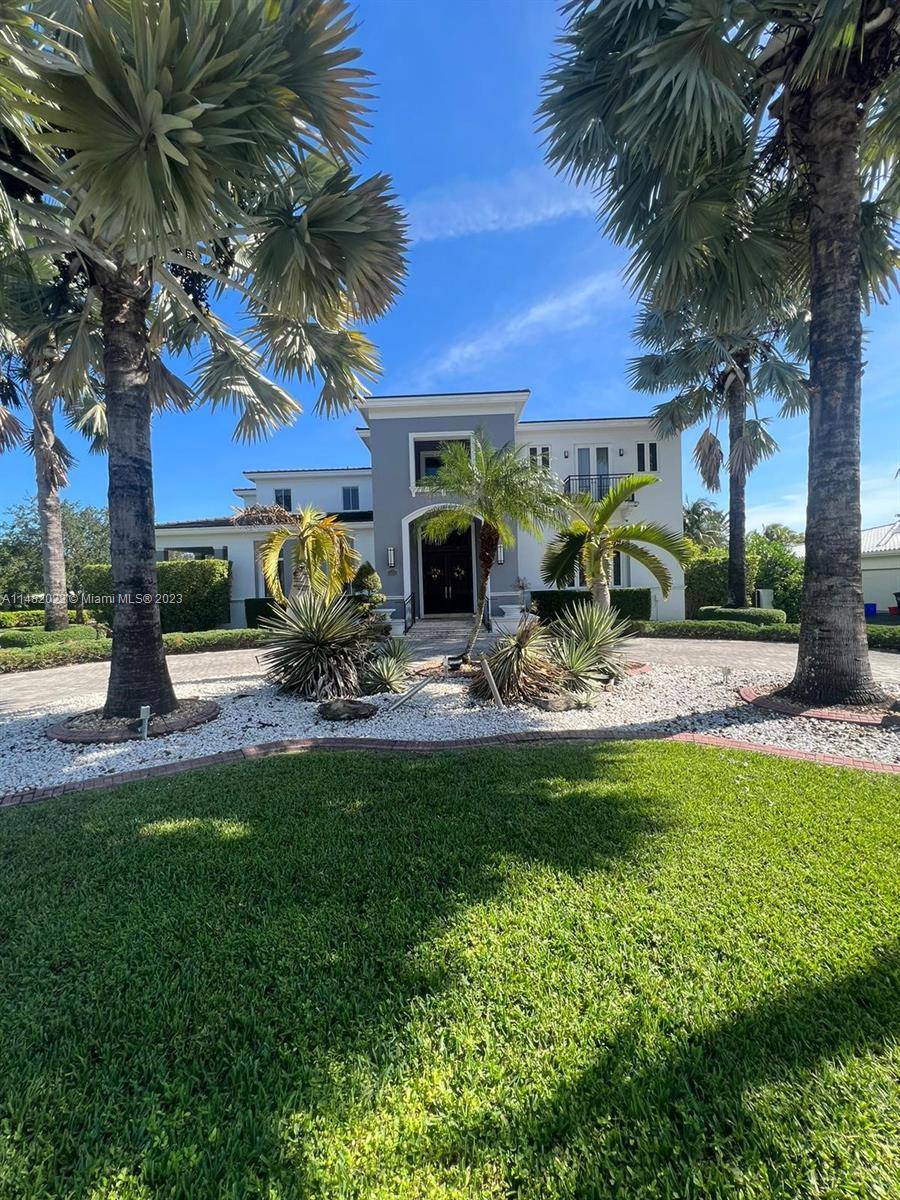 THIS AMAZING CORNER HOME IN GABLES BY THE SEA HAS EVERYTHING TO OFFER.