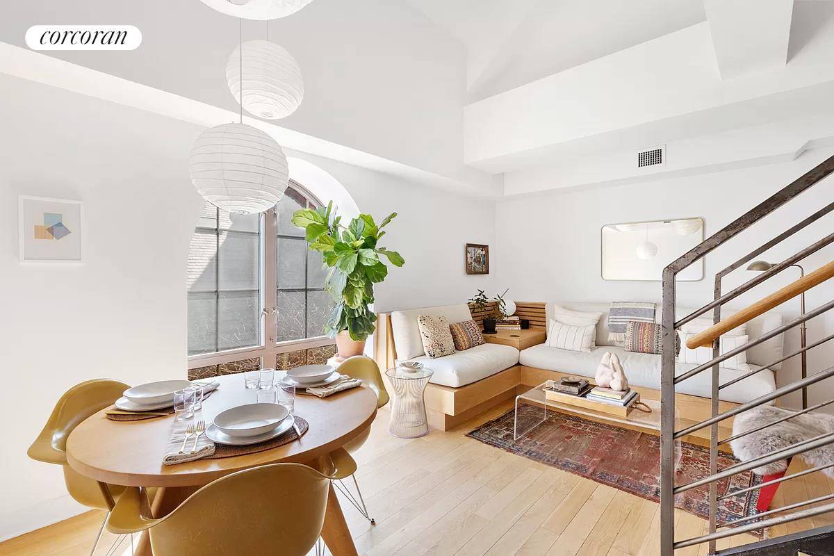 Bright and open duplex ideally situated on the top floor of The Arches of Cobble Hill, a historical gem.