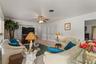 View of family room. The double doors in the back right is a storage closet. This home has LOTS OF STORAGE!