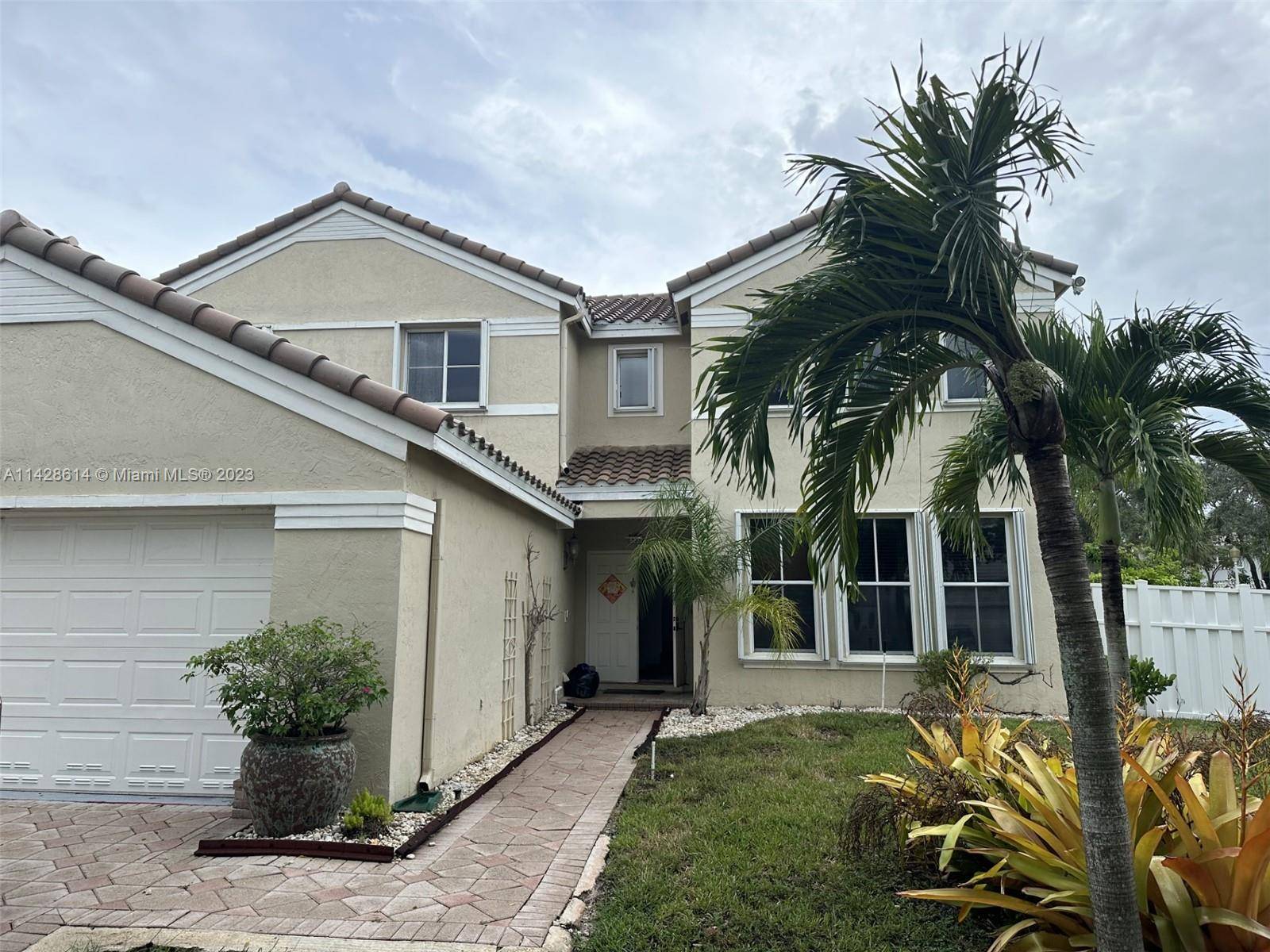 BEAUTIFUL HOME IN THE GATED COMMUNITY OF THE FALLS IN WESTON.
