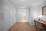 Office with light wood-style flooring and baseboards