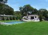 View of swimming pool featuring a hot tub, a patio, view of scattered trees, and a grill