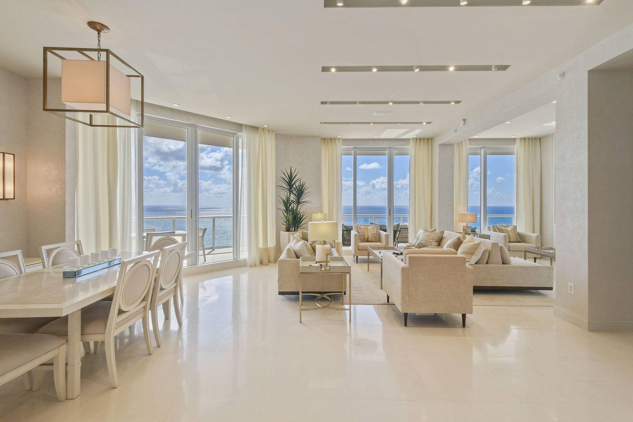 Penthouse condo featuring 10'4 volume ceilings, custom lighting ceiling details, and 9' wall to wall windows with dramatic views.