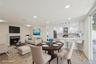 Open-concept living space featuring a dining area, kitchen, and living room