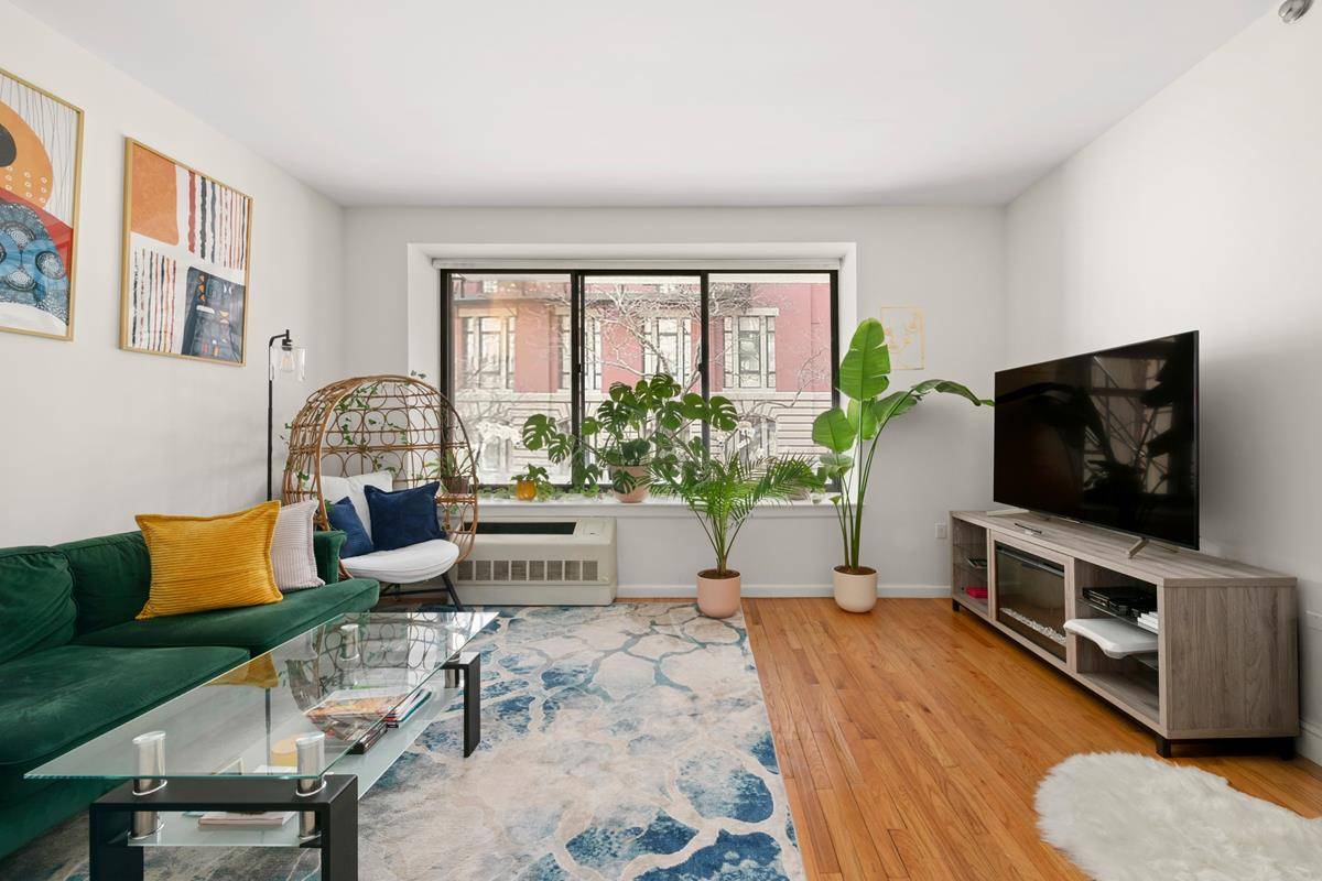 BACK ON THE MARKET, Sunlit Corner 2 Bedroom Condo with Low Carrying Costs This beautifully renovated 2 bedroom, 2 bathroom home offers a bright, airy layout with exceptional natural light.