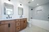 Full hall bath serving the secondary bedrooms, designed with modern finishes and functionality in mind.