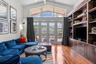 Family room with French doors overlooking the screened lanai.