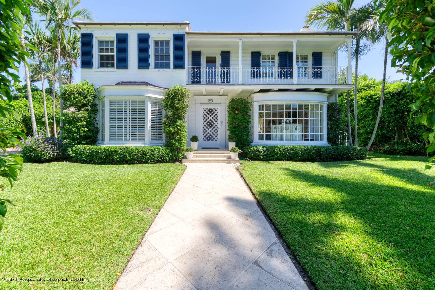 Charming Monterey Colonial on one of Palm Beach's prettiest streets.
